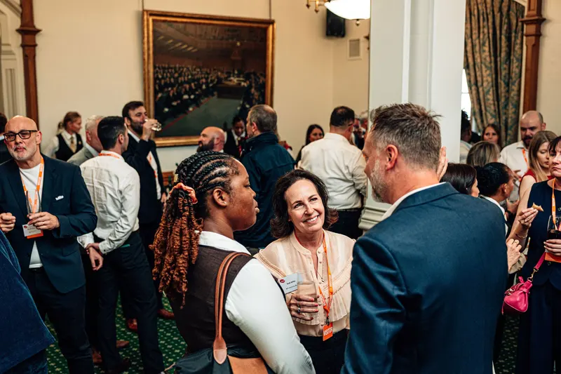 Attendees talking during the event