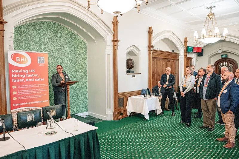 Guests listening to a speaker in the Churchill Room